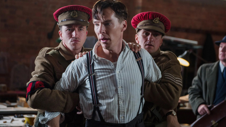 Turing is held back by soldiers