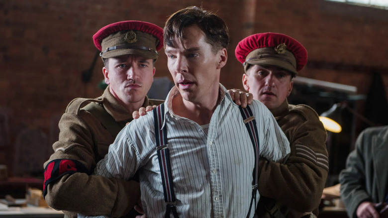 Turing is held back by soldiers