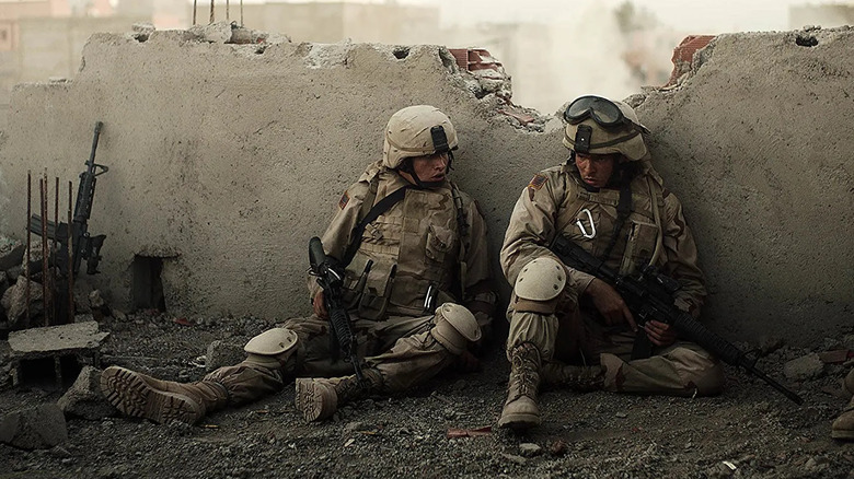 Two soldiers behind a wall