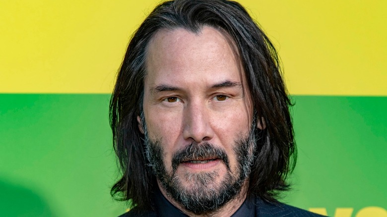 Keanu Reeves with yellow and green background