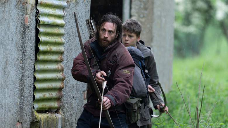 Jamie and Spike sneaking around outside of old building