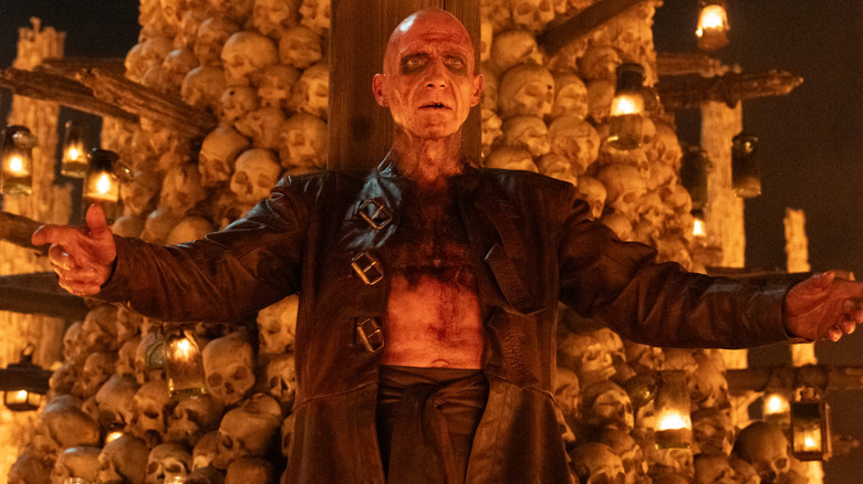 Dr. Ian Kelson by his skull tower in 28 Years Later: The Bone Temple