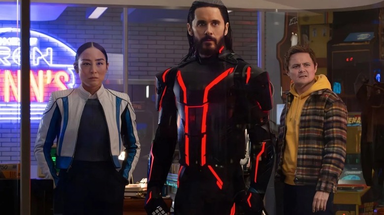 Eve, Ares, and Seth Flores standing together in Tron: Ares