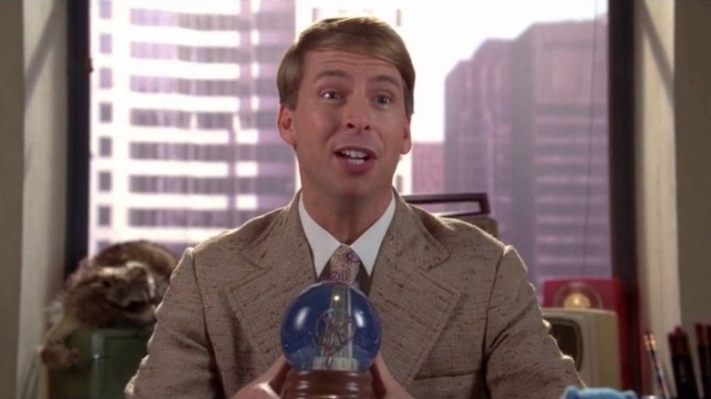 Kenneth Parcell holding a snowglobe