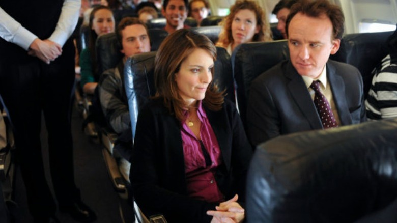 Liz Lemon talks to her seatmate on plane