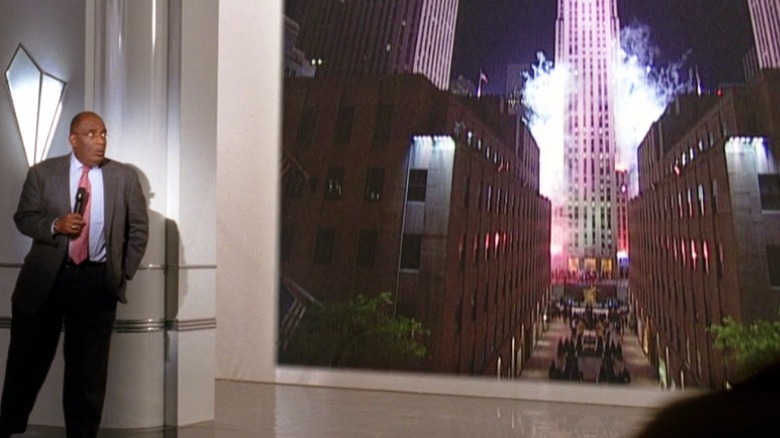 Al Rocker backing away from a live feed of fireworks