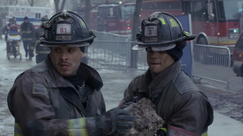 Firefighters moving rubble on Chicago Fire