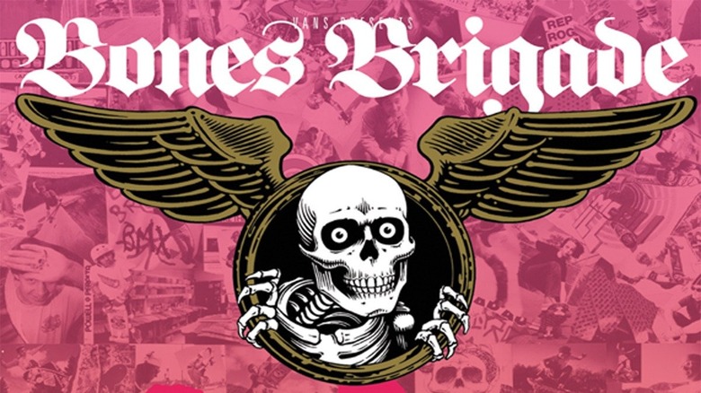 Skull peers from between wings