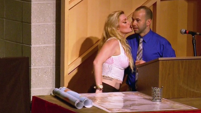 Murr kissing a woman onstage