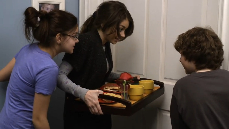 Haley, Alex, and Luke holding breakfast