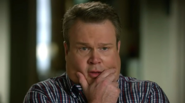 Eric Stonestreet holds chin