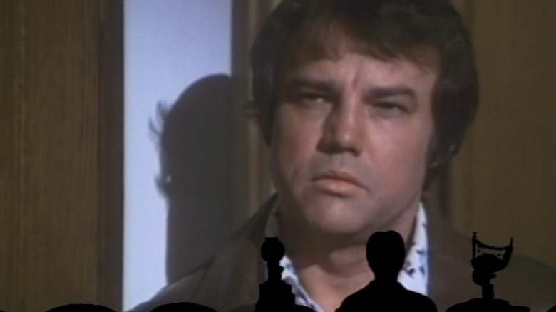 Mitchell aims his gun