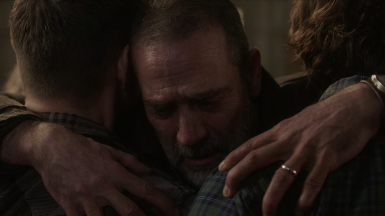 John hugs his boys