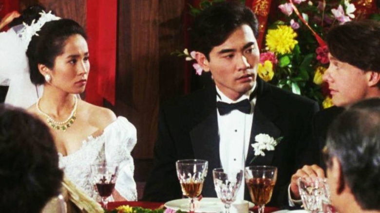 Wai-Tung, Wei-Wei, and Simon surrounded by wedding guests