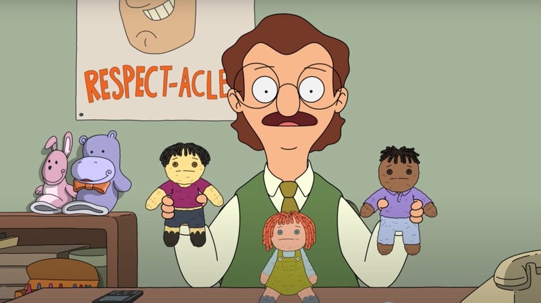 Mr. Frond playing with puppets