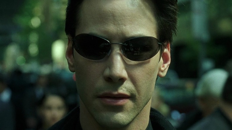 Neo stares head in sunglasses