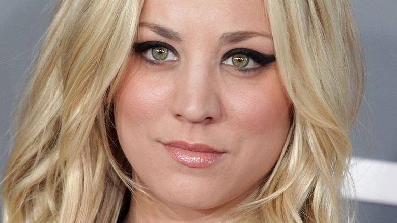 Kaley Cuoco smirking