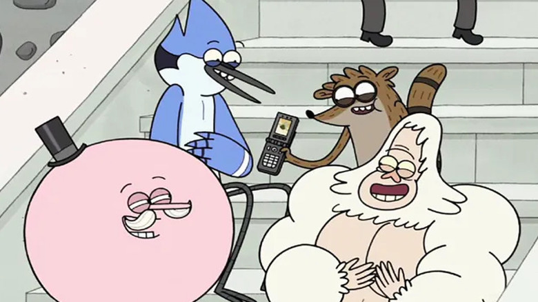 Mordecai and Rigby showing a video to Pops and Skips