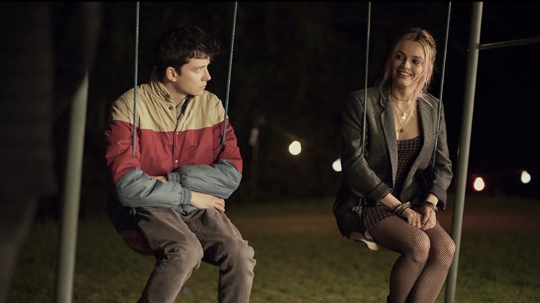Otis and Maeve on swings