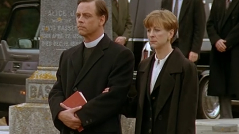 Village of the Damned Reverend George and Sarah walking in cemetery