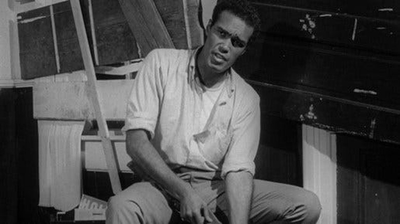 Duane Jones as Ben, staring