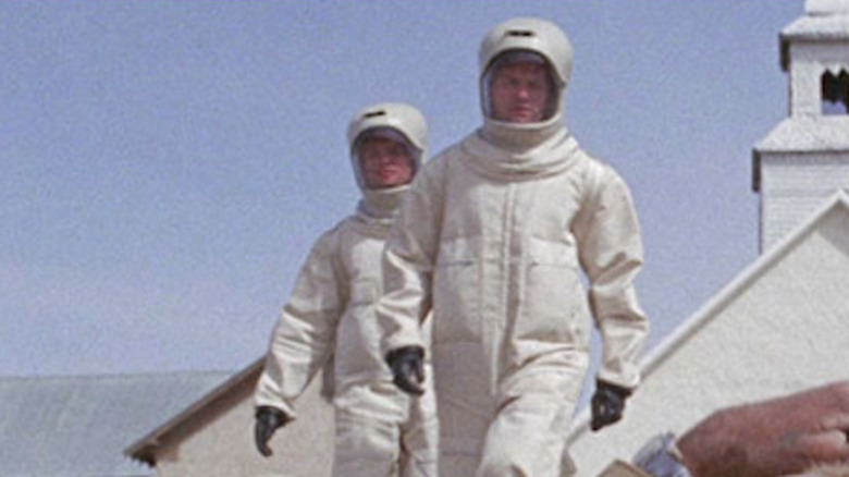 Scientists approach body on ground