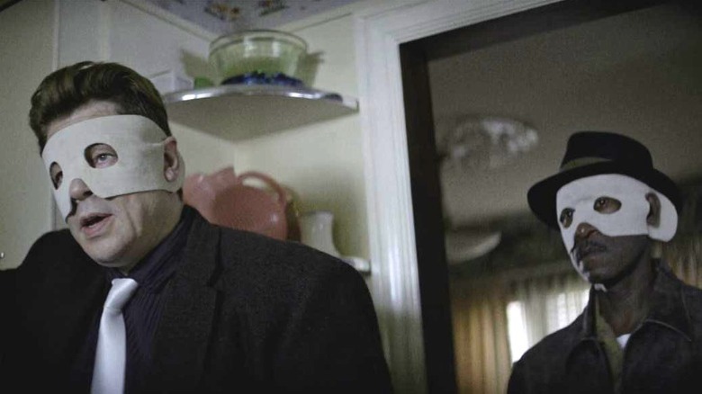 Benicio del Toro and Don Cheadle wearing masks