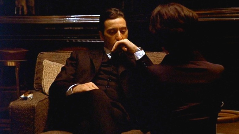 Al Pacino seated, hand on chin