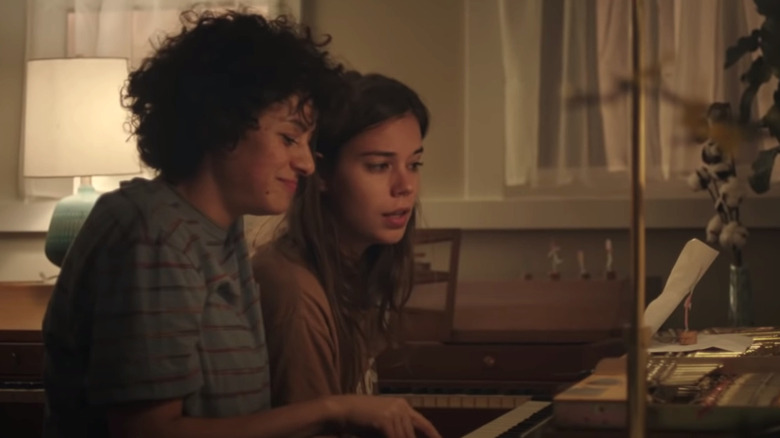 Naima and Sergio sitting at a piano in Duck Butter (2018)