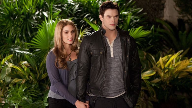 Emmett Cullen standing with his wife in The Twilight Saga: Breaking Dawn - Part Two (2012)