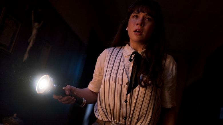Judy Warren holding a flashlight in The Conjuring: Last Rites (2025)
