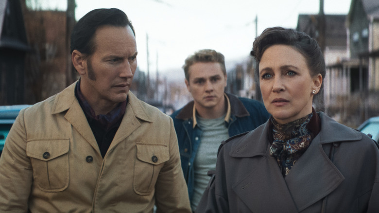 Ed Warren, Tony Spera, and Lorraine Warren walking outside in The Conjuring: Last Rites (2025)