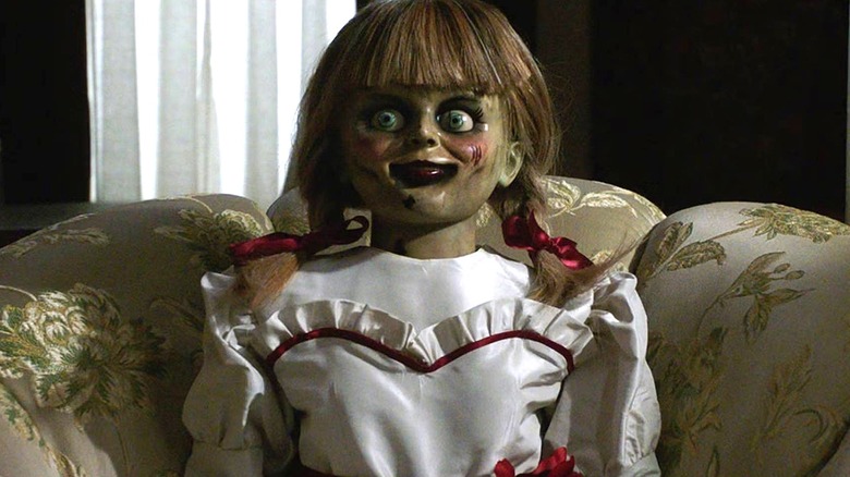 Annabelle resting on couch in Annabelle Comes Home (2019)