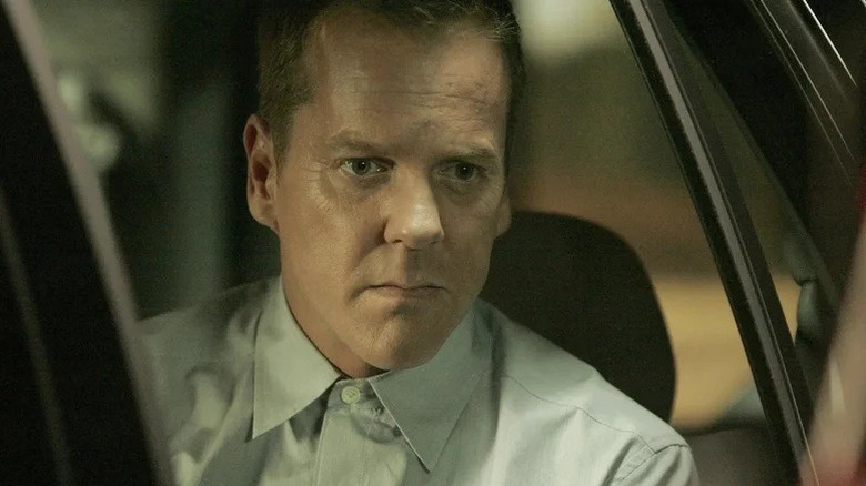 Jack Bauer staring out of a car window in 24