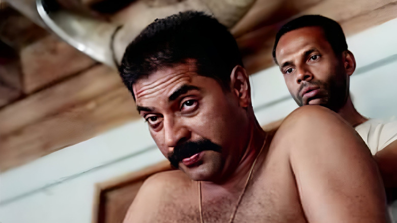 Thommi shooting a dubious expression while shirtless in Vidheyan (1994)