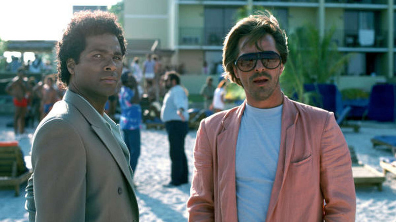 Crockett and Tubbs walk on the beach in 