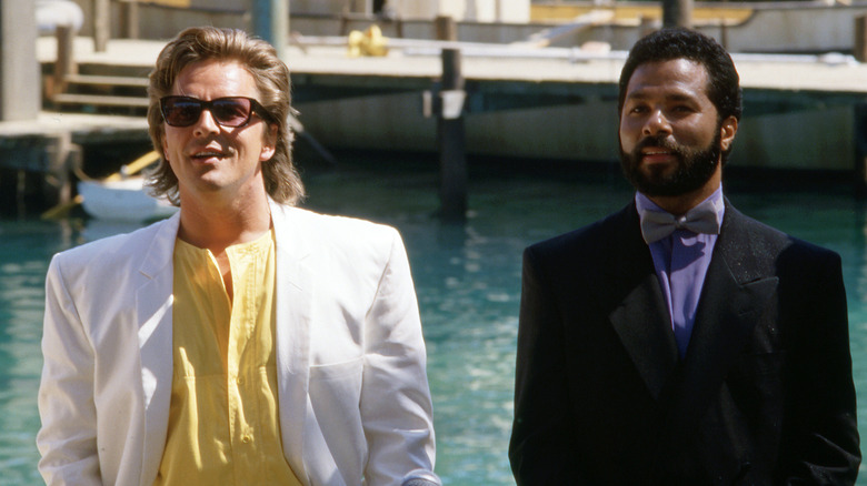 Crockett and Tubbs stand on a pier in "Miami Vice"