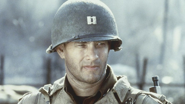 Miller standing in uniform and helmet in Saving Private Ryan (1998)