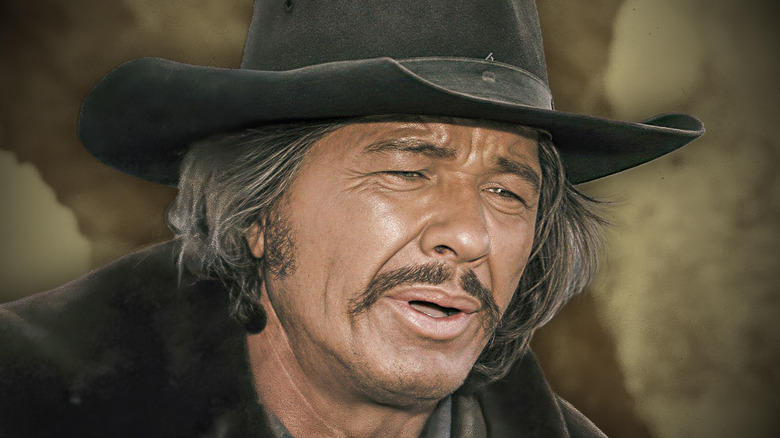 Charles Bronson in a cowboy hat and a mustache