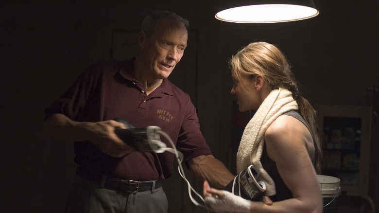 Frankie Dunn gets Maggie Fitzgerald ready for a boxing match in "Million Dollar Baby"