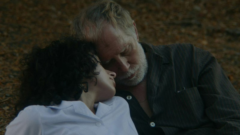 Eleni and Douglas embracing in his backyard in Night Nurse (2026)