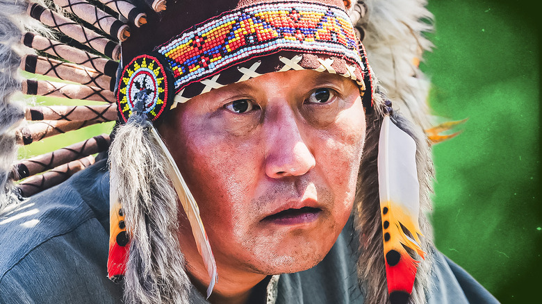 Ki-taek in a Native headdress in Parasite