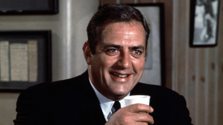Robert T. Ironside laughs while taking a drink in "Ironside"