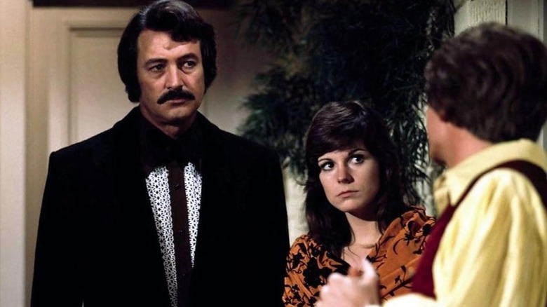 Mac and Sally McMillan question a suspect in "McMillan & Wife"