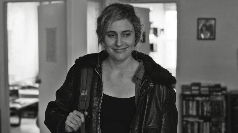 Frances Halladay smiling while holding a cigarette in "Frances Ha"