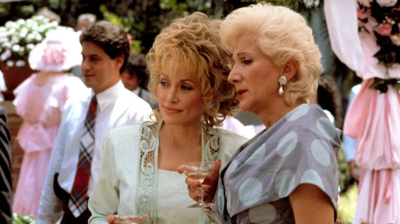Truvy and Clairee dressed up looking at something in Steel Magnolias