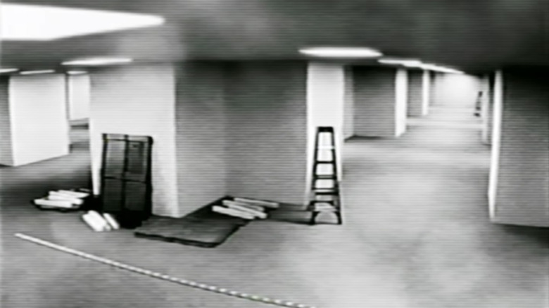 Black and white security footage of the Backrooms in The Backrooms