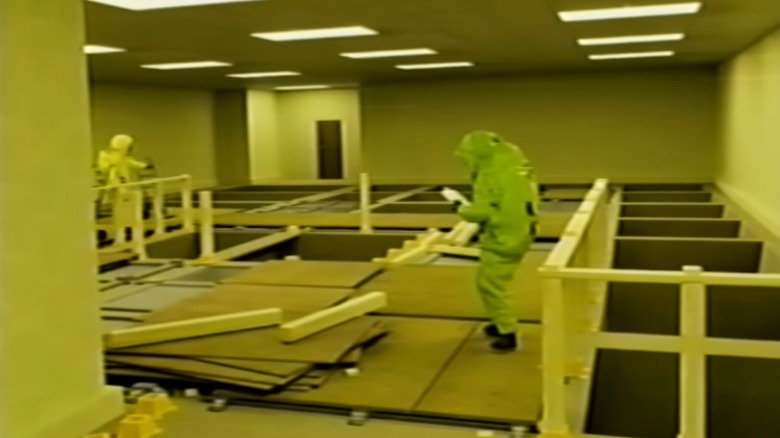 Async research scientists building a walkway over holes in the floor in The Backrooms