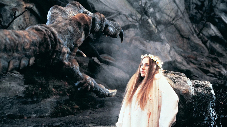 Vermithrax Pejorative reaching out to young woman in  "Dragonslayer"