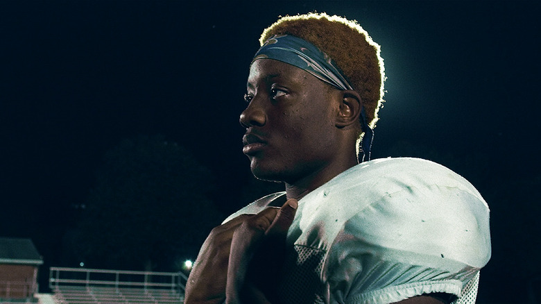 Amaree McKenstry-Hall standing on a football field at night in Audible (2021)